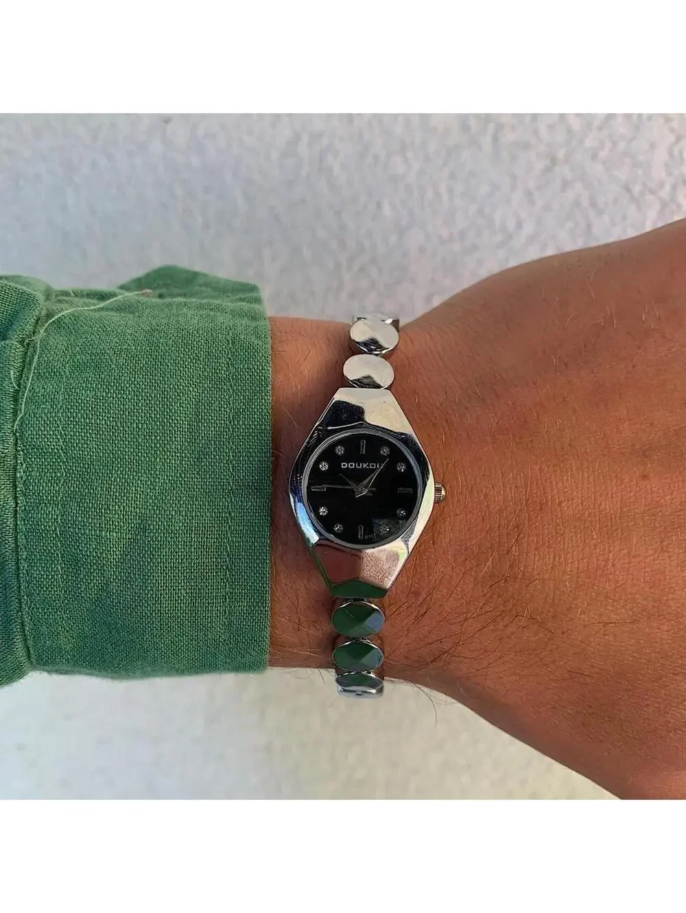 Black and silver watch with a unique design with rhinestones